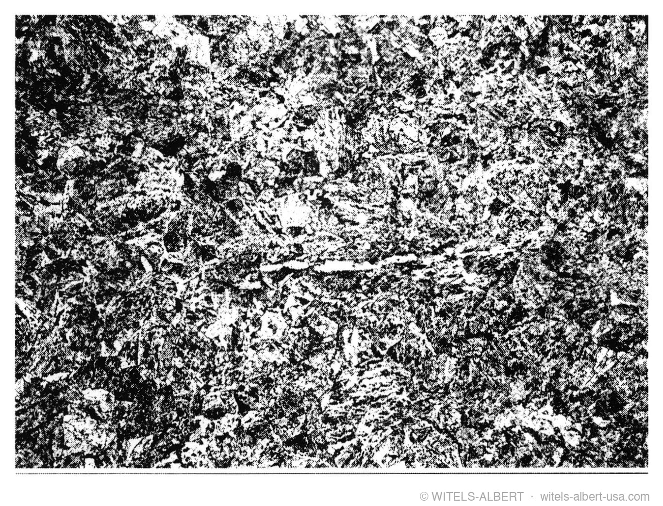 Micrograph showing the microstructure of a steel wire.