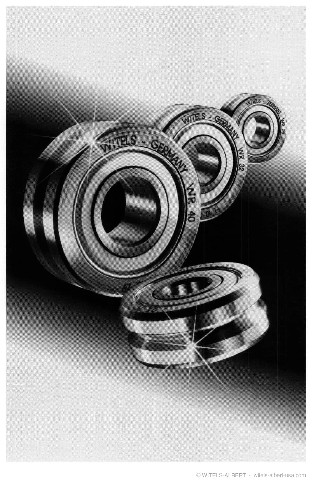 Product photograph of four grooved WITELS Germany straightening rolls (WR series) of different sizes with polished raceways and integrated ball bearings.
